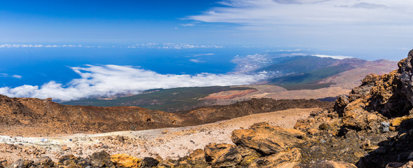 The slopes of the volcano Teide on Tenerife island towering above a rare cloud at its foot. Spain.