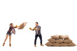 © Ljupco Smokovski - Female farmer throwing a burlap sack at a male farmer