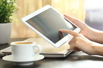 Poster - Girl hands using a tablet at home