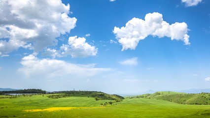 Wall Mural - Green hills and blue sky with clouds. Exploring Armenia