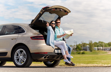 Sticker - happy man and woman with road map at hatchback car