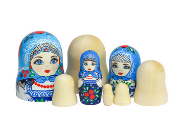 Three traditional Russian matryoshka dolls and blanks for painting dolls. Clean matryoshka.