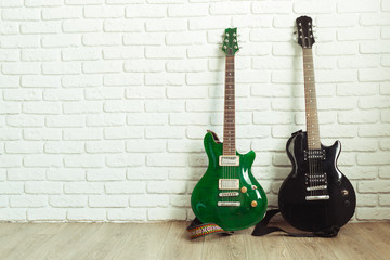 Electric guitar body and neck detail on wooden background