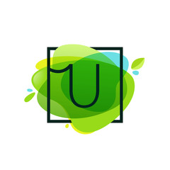 U letter logo in square frame at green watercolor splash backgro