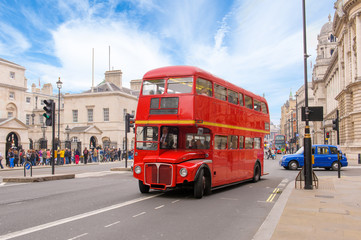 red double decker vintage bus in a street