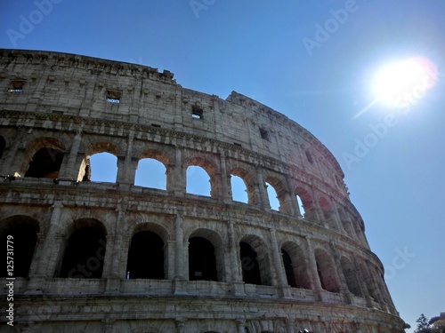 Fotografie, Obraz Roman coliseum exterior with shining sun