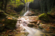 Amazing waterfall in colorful autumn forest - Italy