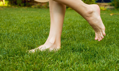 feet on the green grass