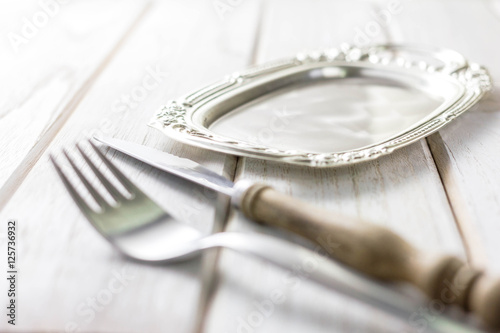 Fotografie, Obraz Vintage fork and knife on wooden background