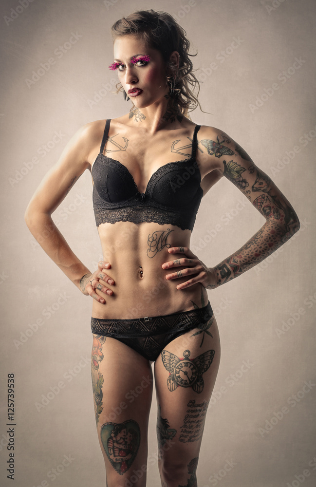 Tattooed woman in black lingerie Stock Photo | Adobe Stock