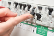 © photographyfirm - Finger About to Switch on LIghting Through RCD Circuit Breaker