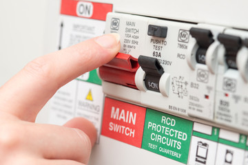 Finger on MAIN Switch on RCD Circuit Breaker Board