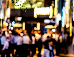 Abstract bokeh background of business people meet at bar on happy hour
