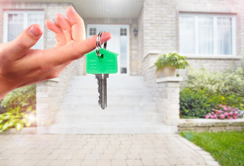 Poster - Hand with house key.