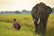 Beautiful Thai local woman working happy wiht elephant,thailand