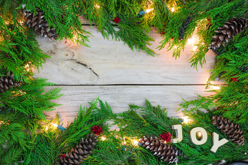 Wall Mural - Christmas background with decorated garland border and JOY