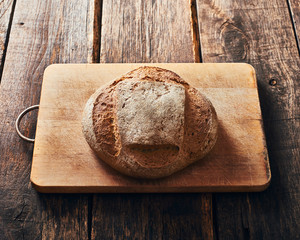 Homemade bread on wooden cutting board