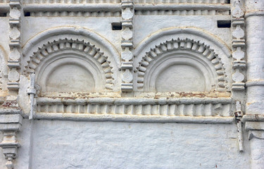 white medieval decorative arched stucco elements and decoration