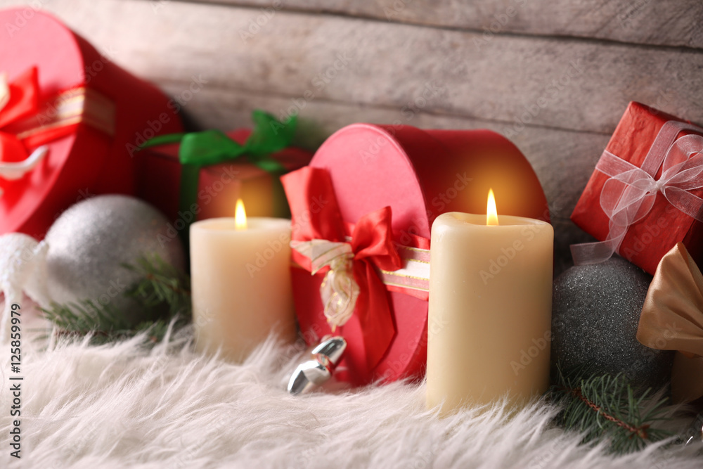 Christmas composition with gift boxes and decorations on wooden background