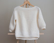 © sedan504 - White sweater knitted manually
