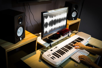 Wall Mural - sound engineer, composer working in digital editing & recording studio for post production or broadcasting