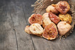 Dried figs on grey rustic wooden background. Copy space
