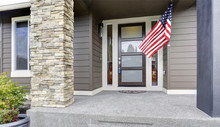 Column Porch Of Luxurious House With American Flag