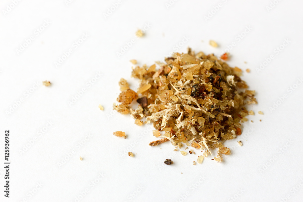 Close-up of natural aromatic incense musk isolated on a white backgroundon Arab environment - obrazy, fototapety, plakaty 