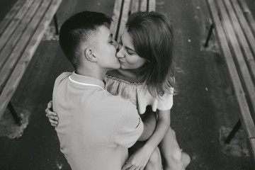 Wall Mural - guy and the girl kissing on a bench