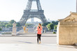 Woman run at tour Eiffel