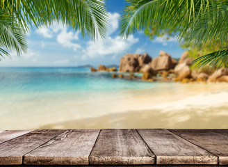 Wall Mural - Empty wooden planks with tropical beach on background