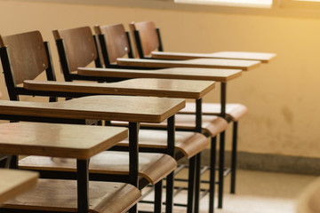 Wall Mural - chair in empty classroom, lecture armchairs in school
