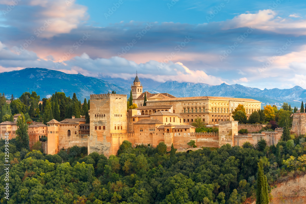 Palace and fortress complex Alhambra with Comares Tower, Palacios Nazaries and Palace of Charles V during sunset in Granada, Andalusia, Spain - obrazy, fototapety, plakaty 