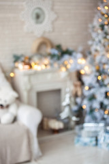 Wall Mural - Modern white tree decorated in christmas toys defocused with bokeh effect. Merry christmas and new year background.