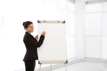 Wall Mural - Business trainer giving presentation on whiteboard