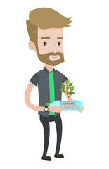 Poster - Man holding plant growing in plastic bottle.