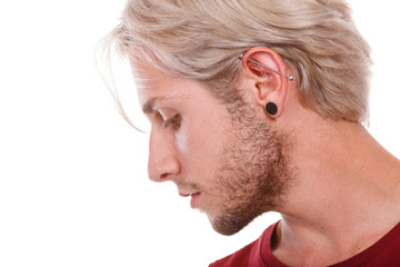 Teen boy with piercing and fashionable hairstyle