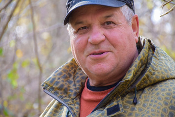 Mature caucasian man in the autumn forest