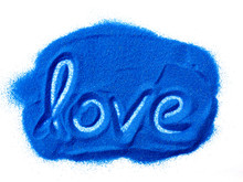 Word Love On Blue Sand Isolated On White Background.Love Concept.Valentine's Day Concept.