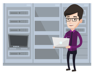 Poster - engineer working on laptop in network server room.