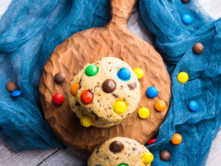 Chocolate chip cookies with colorful candies. Top view
