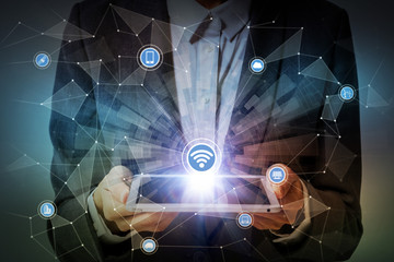 Fototapete - woman holding tablet device and internet of things concept