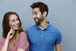 Couple smiling at each other in polo shirts