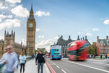 Poster - Tourists along Westminster Bridge in London. Blurred long exposu