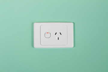 Australian electricity wall socket illustrating expensive power, green energy and bill shock.