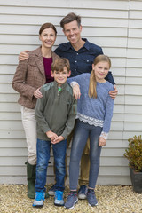 Wall Mural - Happy Family Mother Father Son Daughter Outside