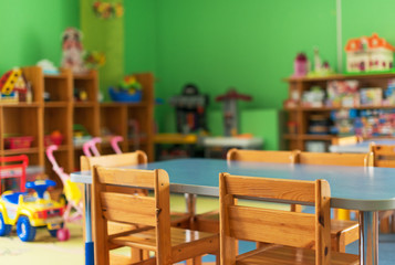 chairs, table and toys. interior of kindergarten.