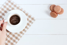 Hot Chocolate With Macarons On A White Background. Women Holding Cup, Film Effect