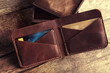 Leather wallet on wooden background
