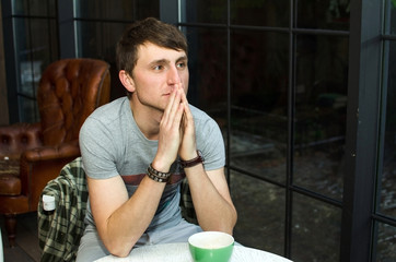 Young man drinking hot coffee